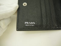 プラダ コンパクトウォレット レザー黒 リボンロゴ 2折財布 スモールウォレット 未使用@181